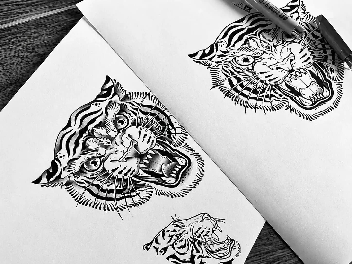 Ink flash of two tiger heads